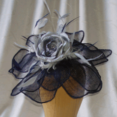 Navy flower with silk rose and feather trim